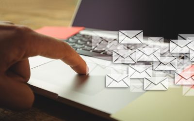 Person reporting a phishing email via Outlook with red alert icon on email message